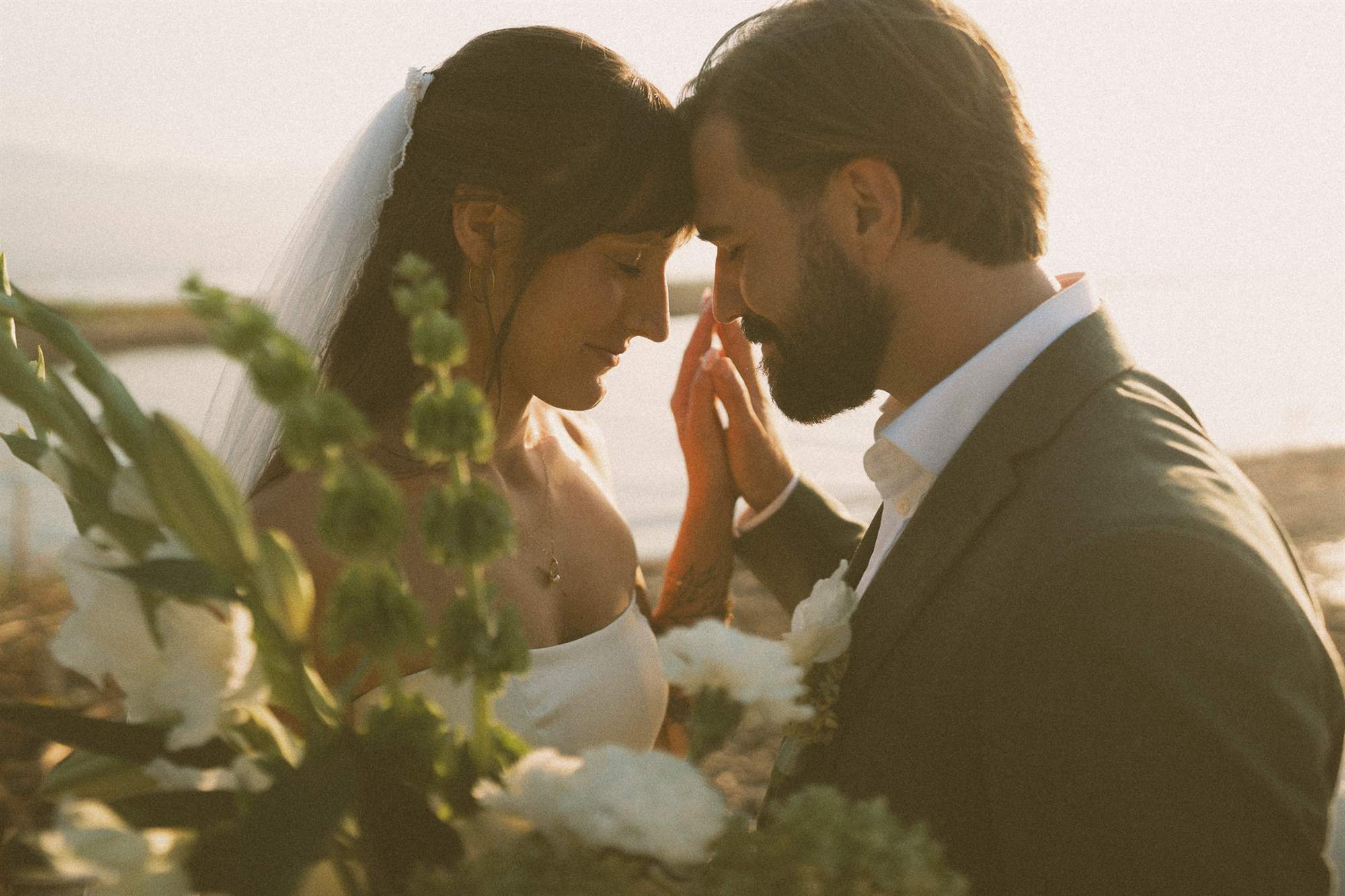 Couple at golden hour beside Okanagan Lake during a Kelowna wedding film