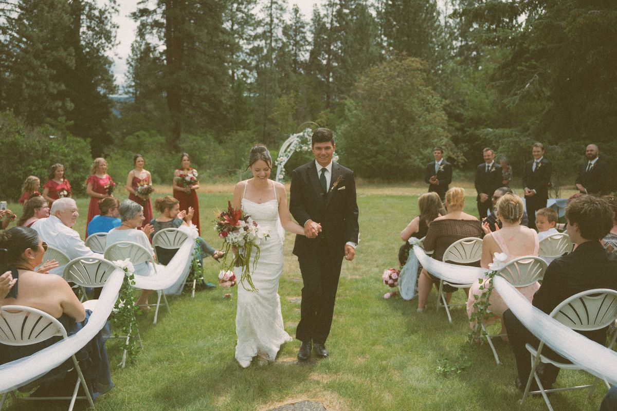 The newlyweds walking back down the aisle after the ceremony