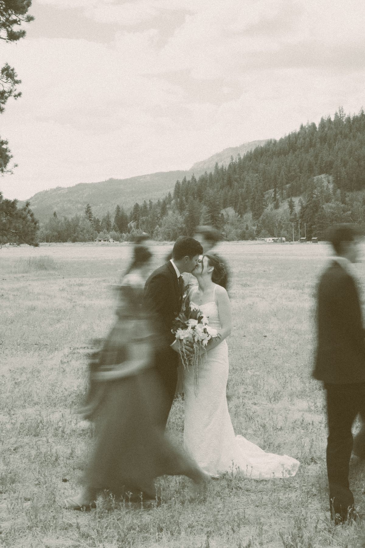 Black and white motion-blurred frame of the couple in the field