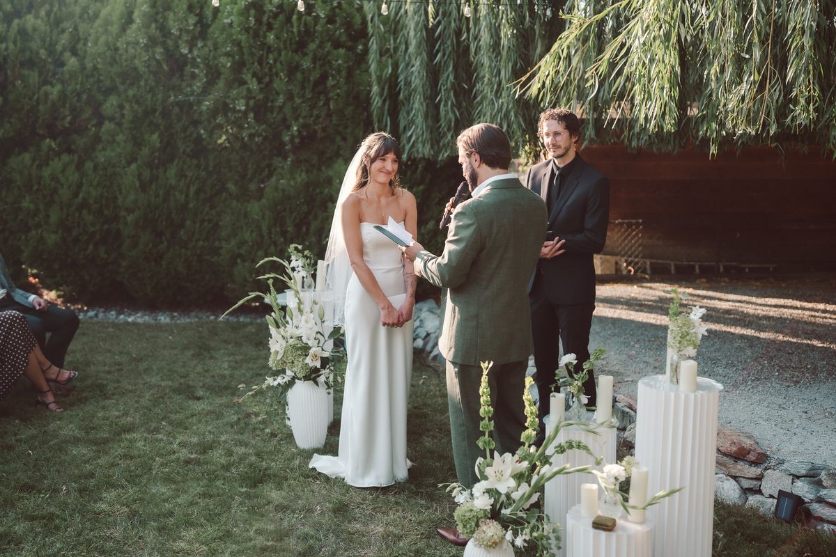 The ceremony beneath the willow with their officiant