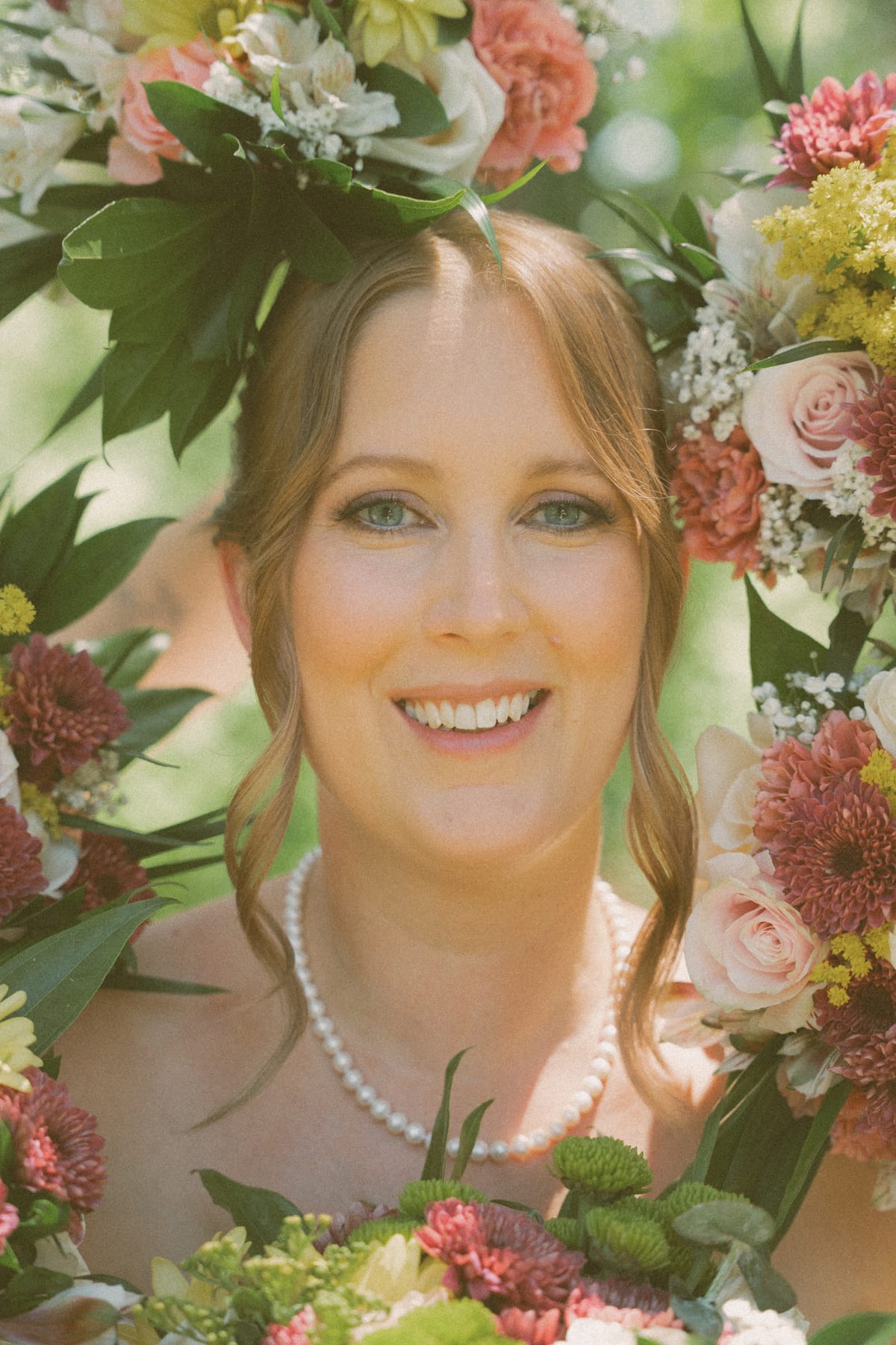 Charlotte's portrait framed by the blooms of her autumn bouquet