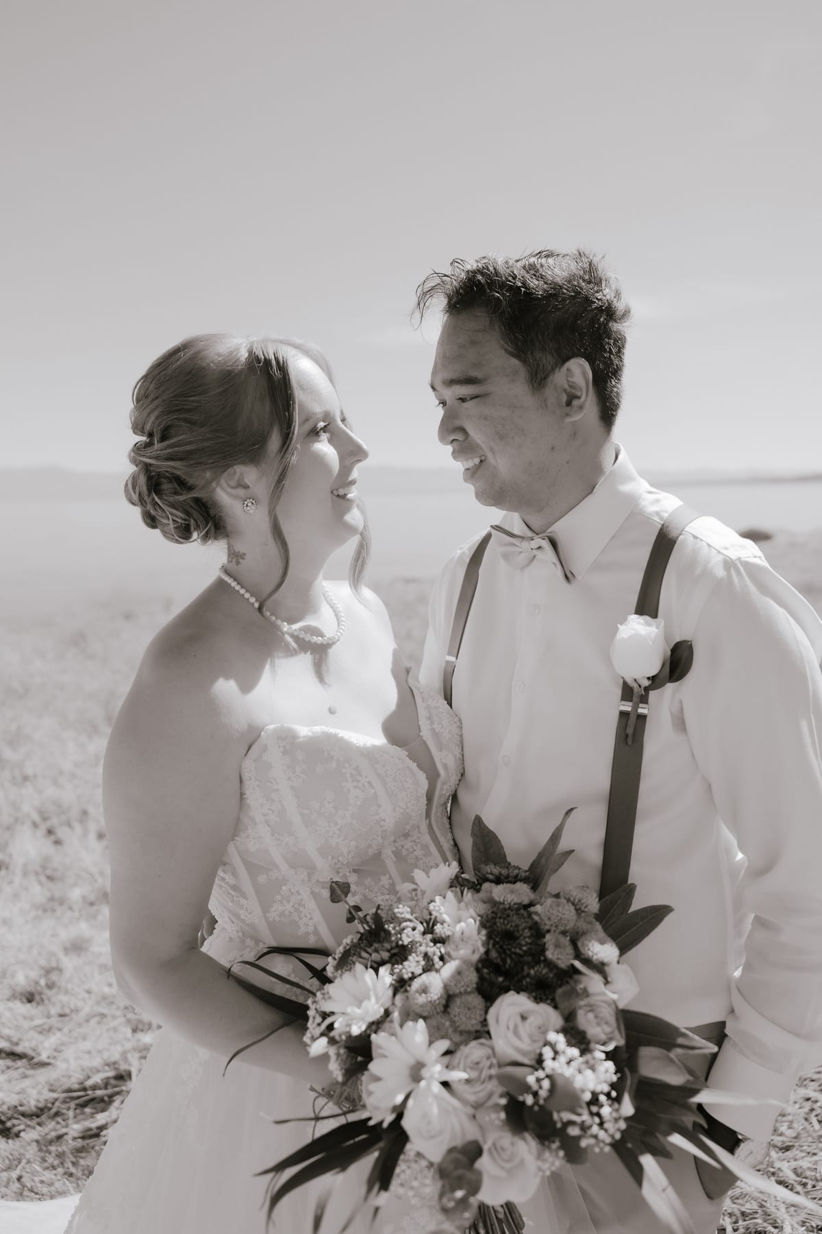 A warm sepia-toned portrait of Charlotte and Vis looking at each other