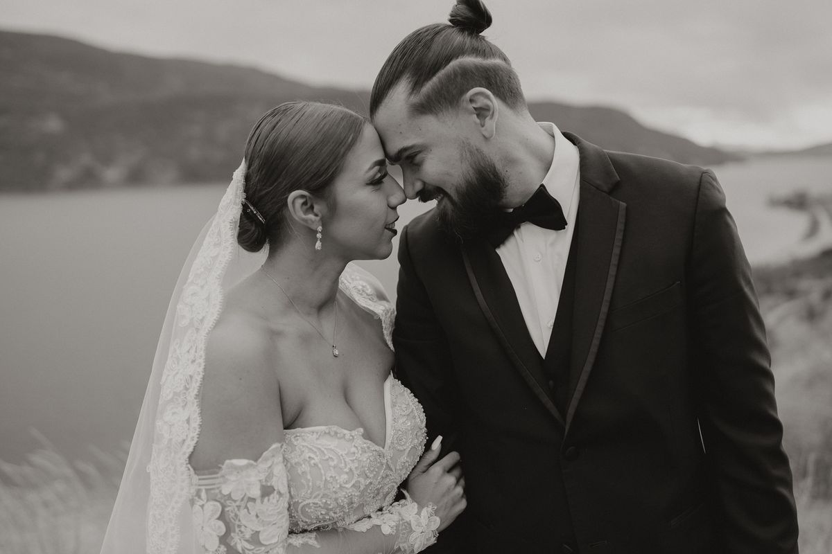 Black and white portrait of the couple touching foreheads