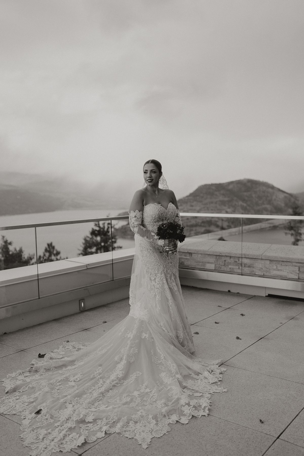 Full-length portrait of the bride on the terrace above the Okanagan hills