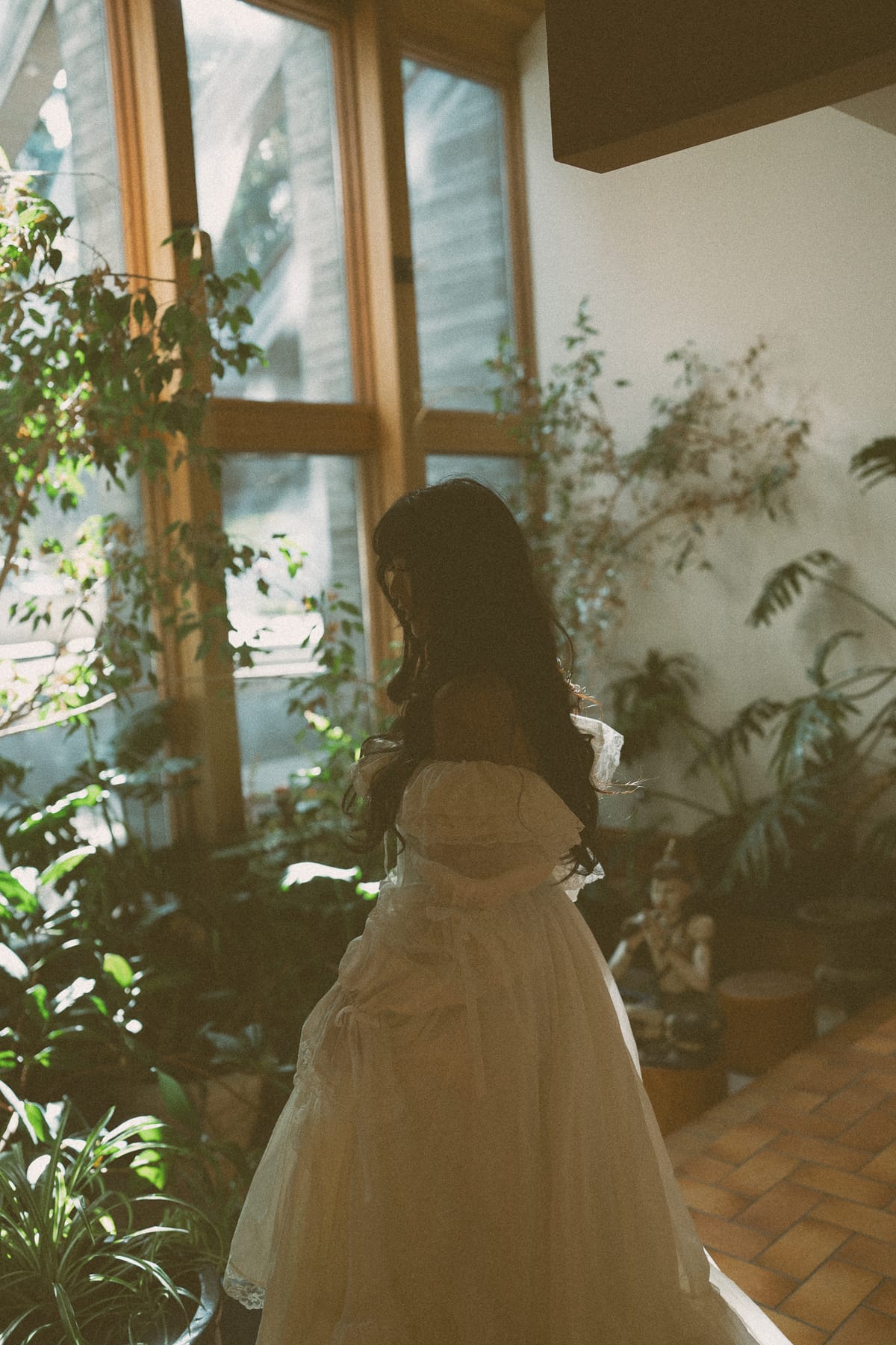 Nina among the greenery of the winery's glass atrium