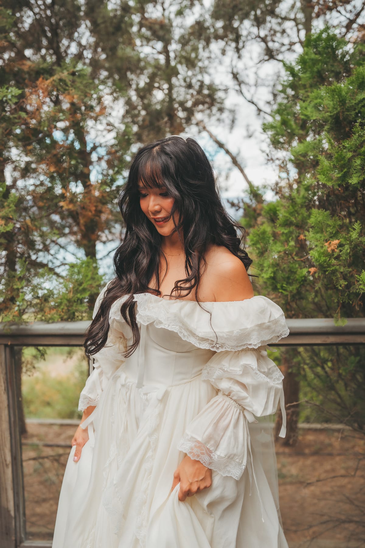 Portrait of Nina in her off-shoulder puff-sleeve vintage gown