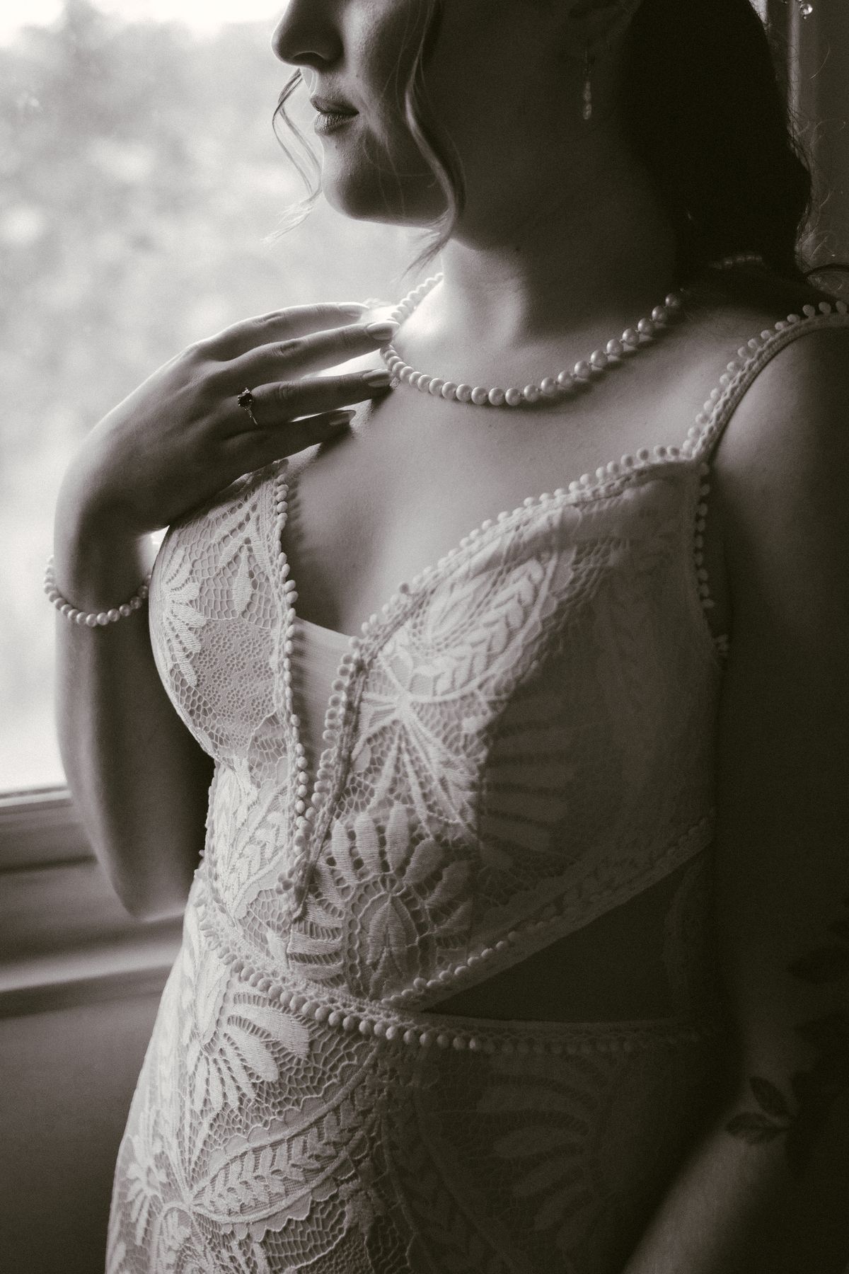 Detail of the bride's beaded gown and necklace
