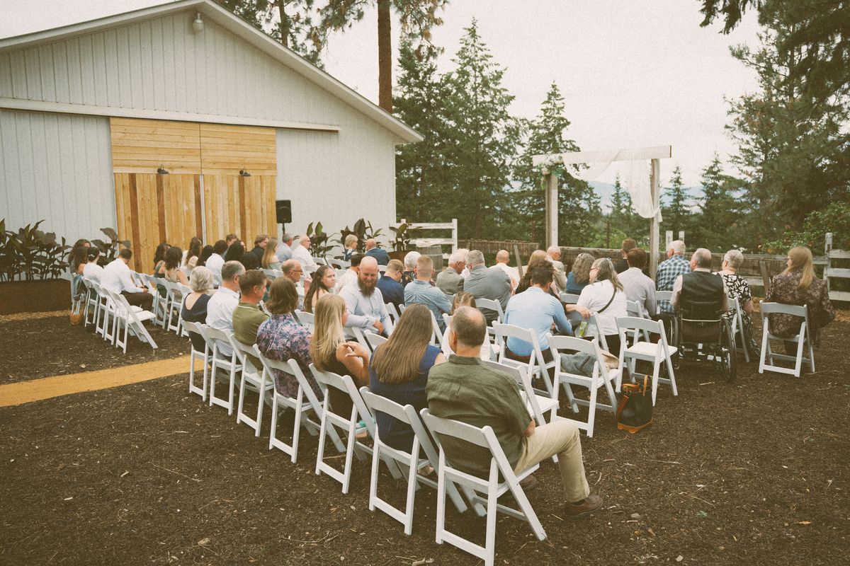 Guests seated for the outdoor ceremony at the farm
