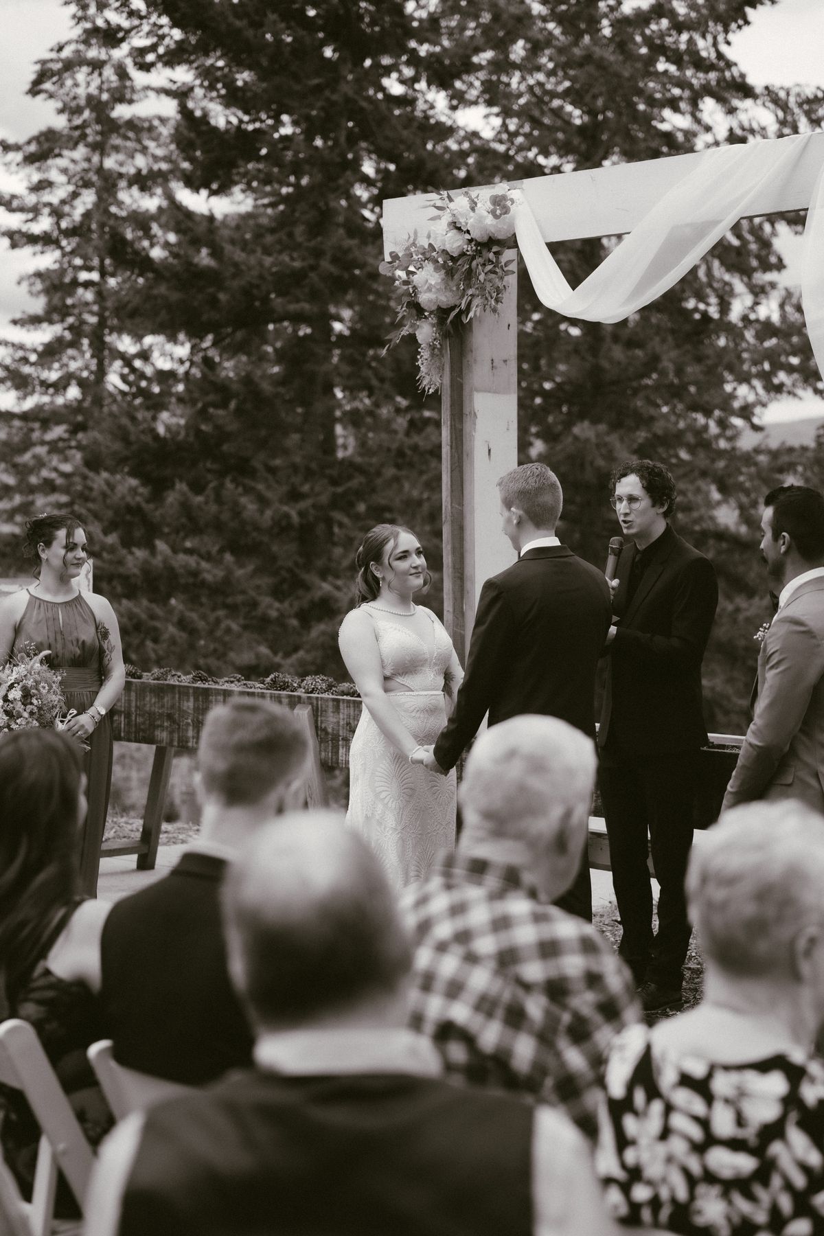 Black and white frame of the ceremony and guests