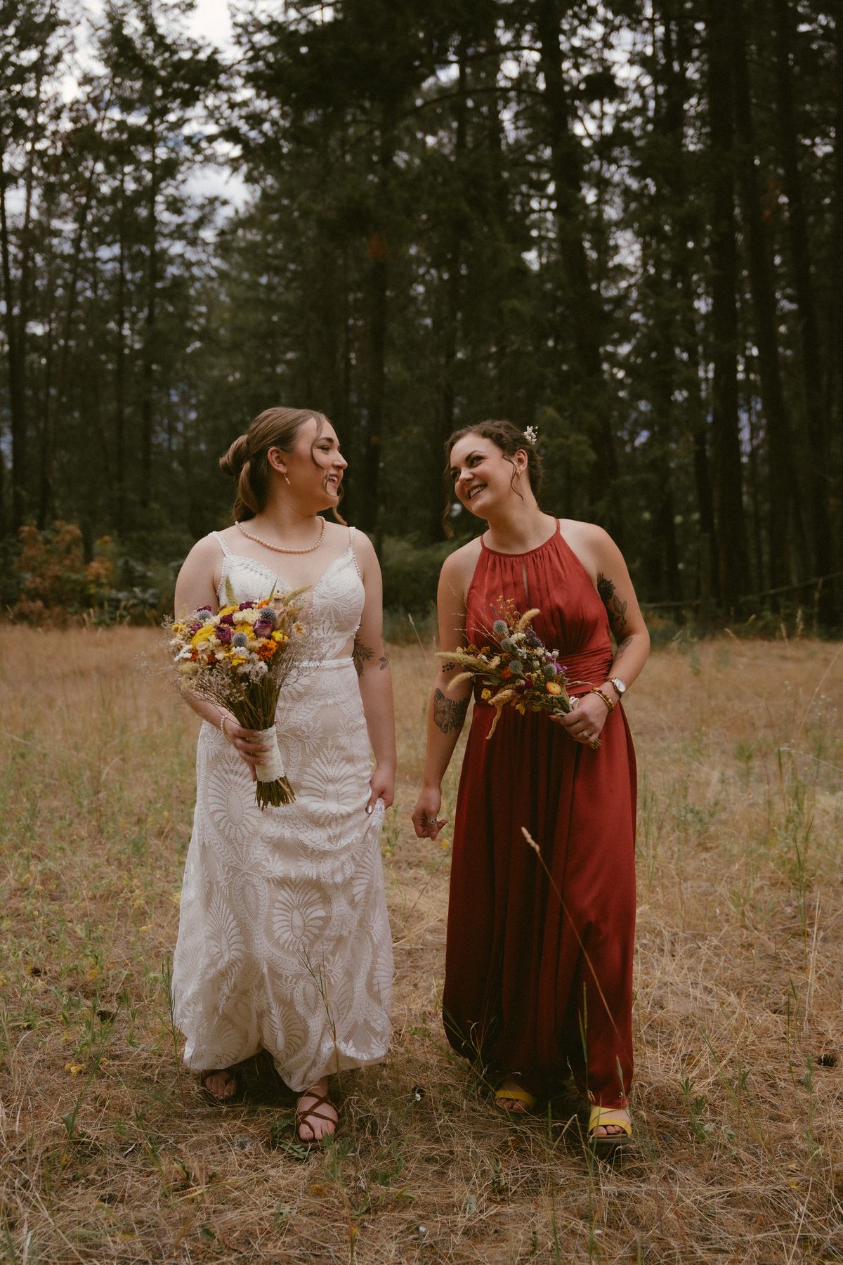 Bride and her bridesmaids walking through the pines at Three Little Birds Farm